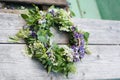 Wreath on wooden background. Slavic divination, tradition Royalty Free Stock Photo