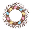 A wreath of young willow branches, decorated with colorful Easter eggs.