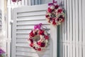 Wreaths of flowers at the door