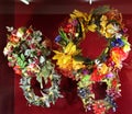 Wreaths with flowers and fruits on a red background