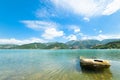 Wreck of a boat on the lake in perspective