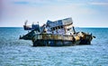 The wreck of a fishing boat sinks in front of Ban Chong Samaesan Bay, Thailand