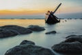 The wreck of an old fishing boat sunk by the sea