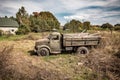 Wreck of old truck standing on the field Royalty Free Stock Photo