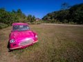 Wreck of The Pink Car is no Driver`s Door Parked in The Lawn Royalty Free Stock Photo