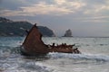 Wreck of stranded fishing boat in waves