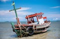 Wreck wooden fishery boat on the beach