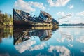 Wreck of a wooden fishing boat abandoned in the clouds Royalty Free Stock Photo