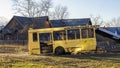 Wreckage bus carcass of yellow school bus in city backyard Royalty Free Stock Photo