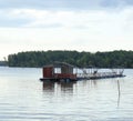 wreckage of floating chalet and fish farm Royalty Free Stock Photo