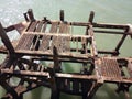 wreckage of old abandoned structure on beach side