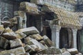 The wreckage of the temples of Angkor Wat on the background of preserved buildings