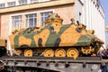 Wrecked armored combat vehicle of terrorists on a railway flatcar