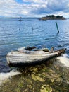 Wrecked boat on the shore in the river Royalty Free Stock Photo