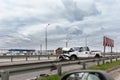 Wrecked car pickup truck crash accident on highway city road. Damaged big white vehicle after collision accident waiting