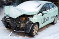 Wrecked car of Uber taxi after a head-on collision in a parking lot