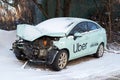 Wrecked car of Uber taxi after a head-on collision in a parking lot