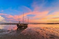 Wrecked fishing boat at sea with sunset Royalty Free Stock Photo