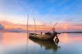 Wrecked fishing boat at sea with sunset in Thailand Royalty Free Stock Photo