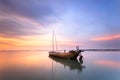 Wrecked fishing boat at sea with twilight Royalty Free Stock Photo