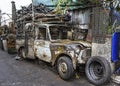 Wrecked pickup truck with pieces of used spare parts .