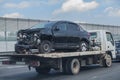 wrecker transports broken car