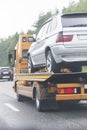 Wrecker transports broken car