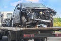 wrecker transports broken car