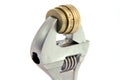 Wrench and coins Royalty Free Stock Photo
