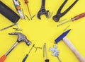 Wrench engineer constructor tools on a denim workers, A yellow background with engineer constructor tools. Several engineer constr