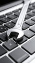 Wrench on a laptop keyboard concept for computer repair and online support services Royalty Free Stock Photo