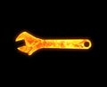 Wrench outline with a bright fire pattern isolated on a black background