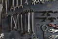 Wrench, Pliers, Clamps. A lot of tools mechanic on old wooden board background