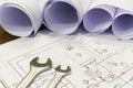 Wrench and project drawings with plumbing system Royalty Free Stock Photo