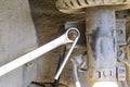 a wrench is put on the nut on the shock absorber of the machine