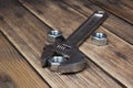 Wrench and screw nut on a wooden background Royalty Free Stock Photo