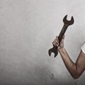 Wrench spanner tool in hand of female worker Royalty Free Stock Photo