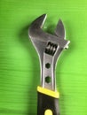 Wrench tool on green background