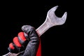 Precision in Motion: Chrome Wrench Tool in Hand with Protective Gloves - Mechanical Mastery
