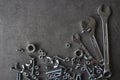 Wrenches, bolts and nuts on dark textured background Royalty Free Stock Photo