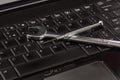 Wrench tool and screwdrivers over a laptop Royalty Free Stock Photo