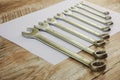 Wrenches of different sizes on a wooden background Royalty Free Stock Photo