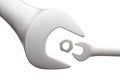 Wrenchs and small metal nut Royalty Free Stock Photo