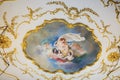 Decorative painted ceiling with Ladies and Cherubs surrounded in gold gilt