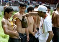 A wrestler has olive oil applied to his body prior to the start of competition at the Kirkpinar Turkish Oil Wrestling Festival, Ed