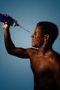 Wrestler refreshes himself with a jet of water