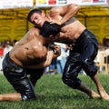 Wrestlers battle for supremacy at the Velimese Turkish Oil Wrestling Festival, Turkey.