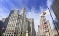 Wrigley Building and Tribune Tower on Michigan Avenue with Illinois flag on the foreground in Chicago Royalty Free Stock Photo