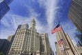 Wrigley Building and Tribune Tower on Michigan Avenue with Illinois flag on the foreground in Chicago Royalty Free Stock Photo