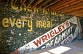 Wrigley chewing gum ad on an old wall of a building under renovation